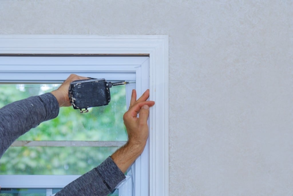 construction worker installing window in a new hou 2021 08 30 22 09 26 utc