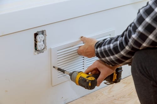 man is installing the wall cover ventilation vent 2021 08 30 22 09 30 utc 1