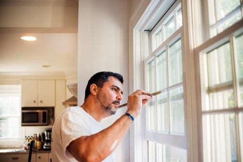 side view of man painting window frame at home 2022 03 09 02 27 51 utc