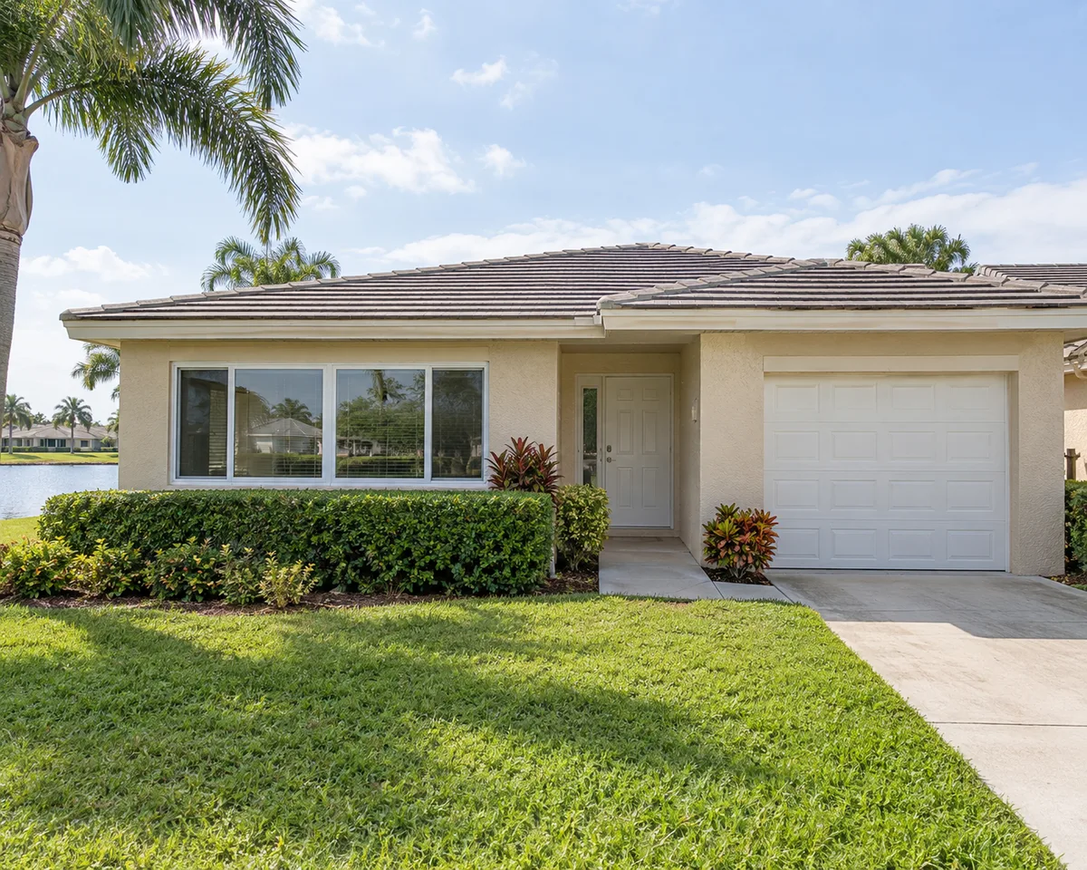 Home with white impact windows in Boynton Beach, Florida