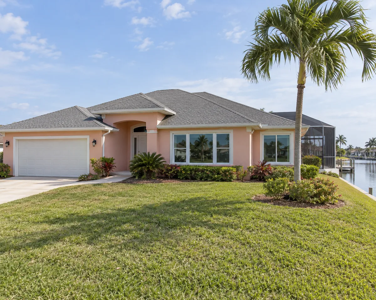 Home with white impact windows in Cape Coral, Florida