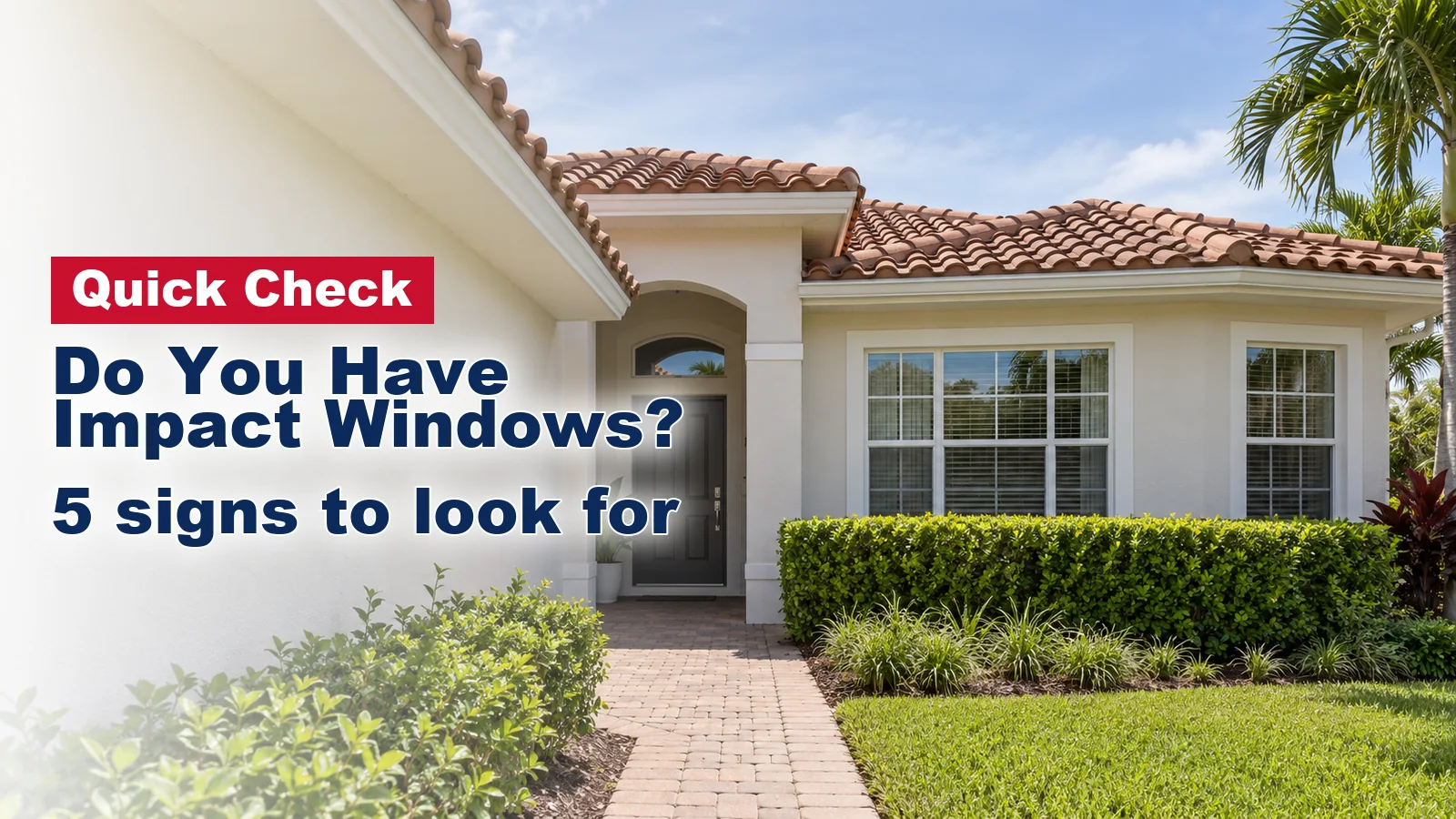 Front windows of a South Florida stucco home seen from the front walk