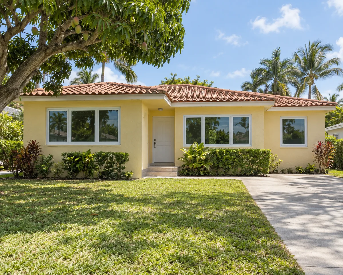 Home with white impact windows in Miami, Florida